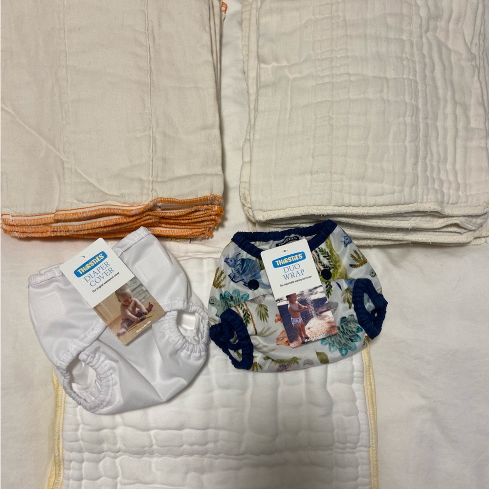 NEW and GENTLY USED cloth prefolds (31) and NWT covers (2)